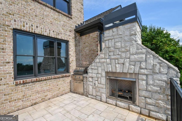 2771 Point Overlook, Gainesville, GA 30501 - view of patio / terrace featuring a grill, exterior kitchen, and an outdoor stone fireplace