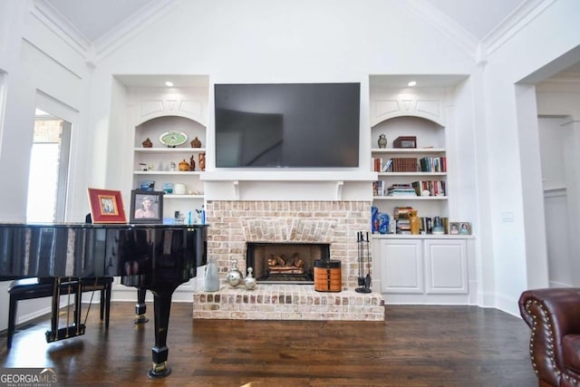 2771 Point Overlook, Gainesville, GA 30501 - living room featuring vaulted ceiling, a brick fireplace, crown molding, and built in shelves