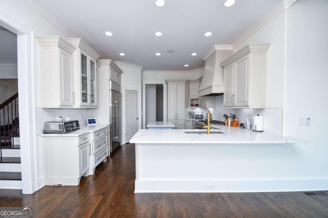 2771 Point Overlook, Gainesville, GA 30501 - kitchen featuring dark hardwood / wood-style floors, kitchen peninsula, custom exhaust hood, and white cabinets