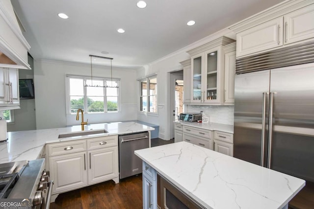 2771 Point Overlook, Gainesville, GA 30501 - kitchen featuring sink, premium appliances, hanging light fixtures, light stone counters, and crown molding