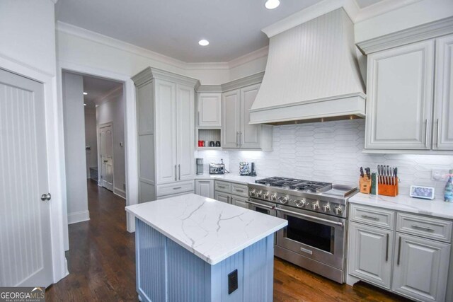 2771 Point Overlook, Gainesville, GA 30501 - kitchen featuring gray cabinets, double oven range, light stone counters, custom range hood, and a kitchen island