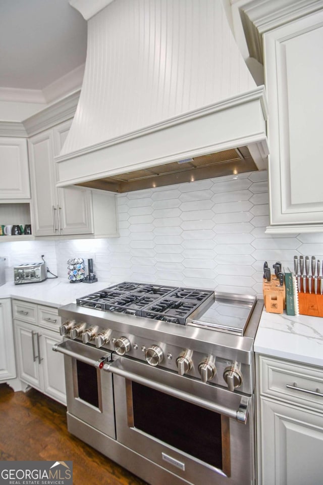 2771 Point Overlook, Gainesville, GA 30501 - kitchen featuring double oven range, decorative backsplash, white cabinets, and premium range hood