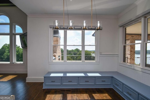 2771 Point Overlook, Gainesville, GA 30501 - unfurnished dining area with dark wood-type flooring, ornamental molding, and a chandelier