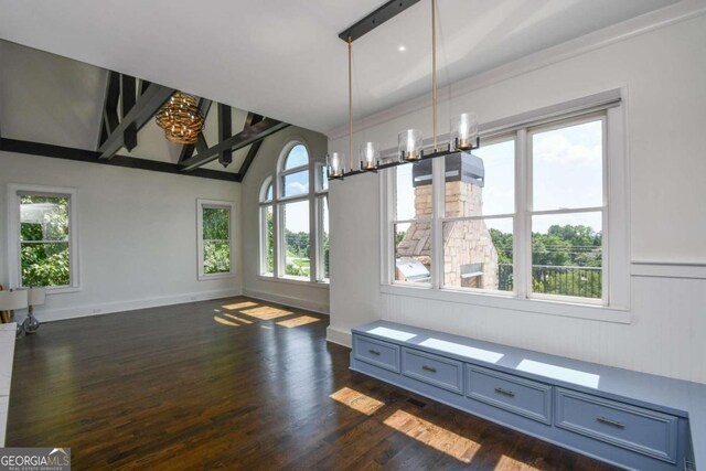 2771 Point Overlook, Gainesville, GA 30501 - unfurnished dining area with an inviting chandelier, lofted ceiling, and dark hardwood / wood-style flooring