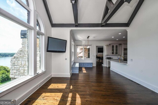 2771 Point Overlook, Gainesville, GA 30501 - unfurnished living room featuring dark hardwood / wood-style flooring, a water view, and beam ceiling