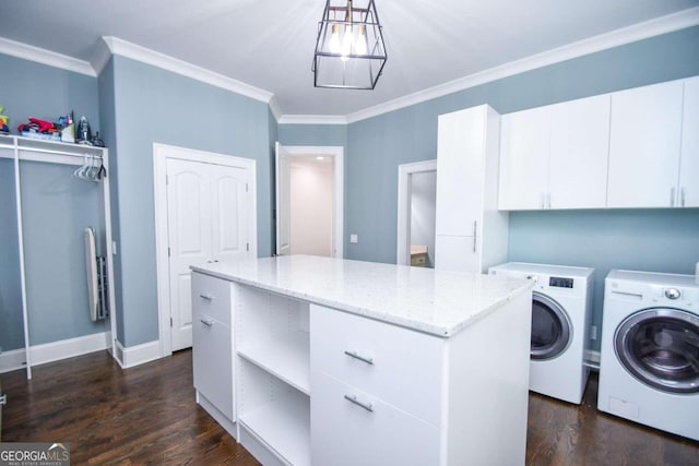 2771 Point Overlook, Gainesville, GA 30501 - laundry area with crown molding, dark wood-type flooring, cabinets, a notable chandelier, and washer and dryer