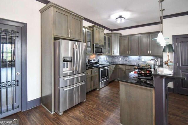2771 Point Overlook, Gainesville, GA 30501 - kitchen featuring tasteful backsplash, dark hardwood / wood-style floors, stainless steel appliances, and decorative light fixtures
