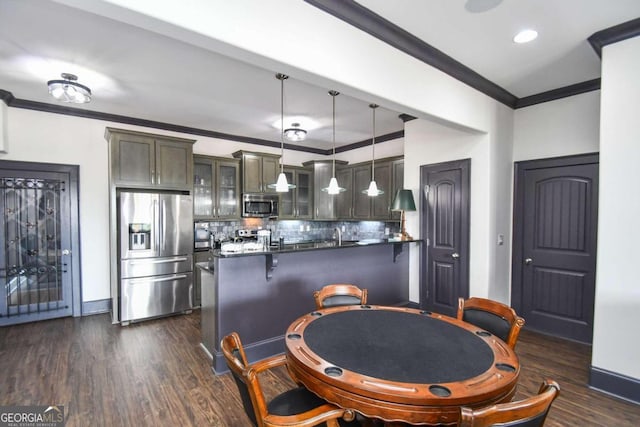 2771 Point Overlook, Gainesville, GA 30501 - kitchen with a breakfast bar, ornamental molding, appliances with stainless steel finishes, kitchen peninsula, and pendant lighting