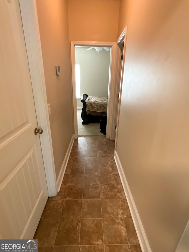 corridor with tile patterned flooring