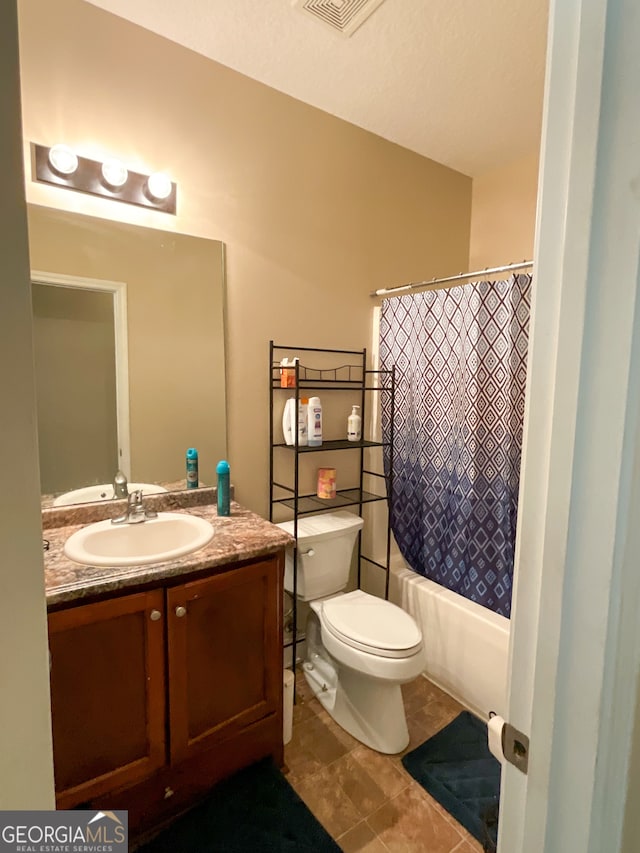 full bathroom featuring tile patterned flooring, vanity, shower / bathtub combination with curtain, and toilet