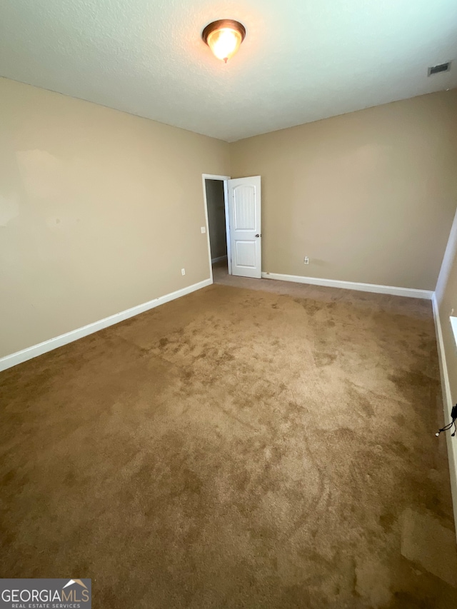 spare room with carpet floors