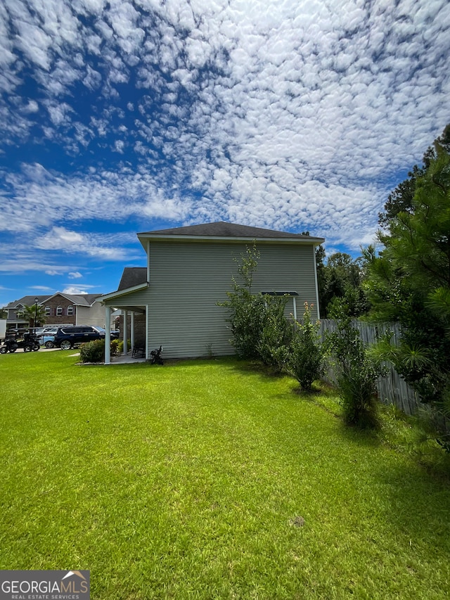 exterior space featuring a patio and a lawn