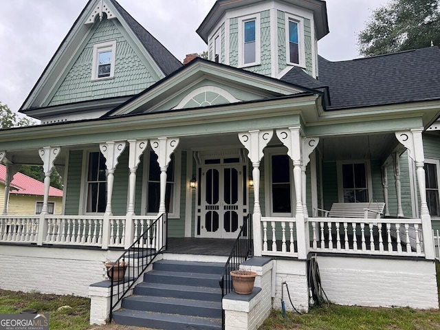 victorian-style house with covered porch