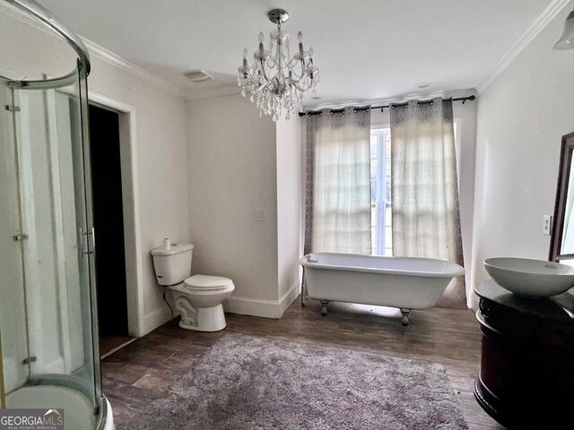 bathroom with wood-type flooring, vanity, ornamental molding, and toilet