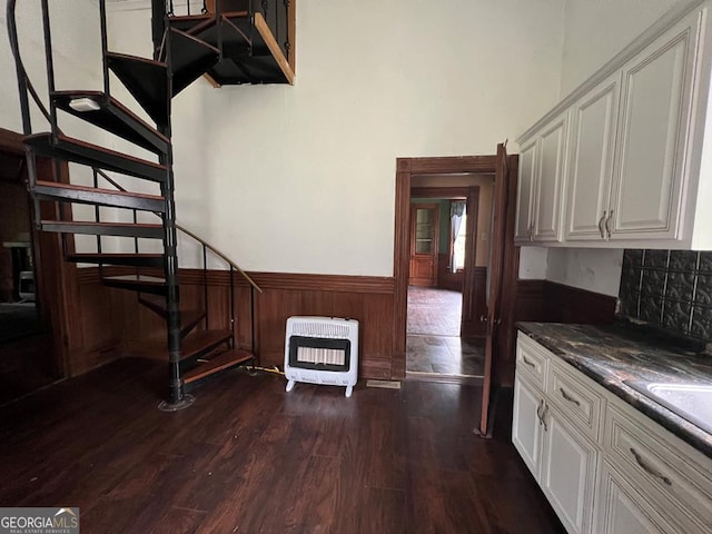 kitchen featuring dark hardwood / wood-style floors and white cabinetry