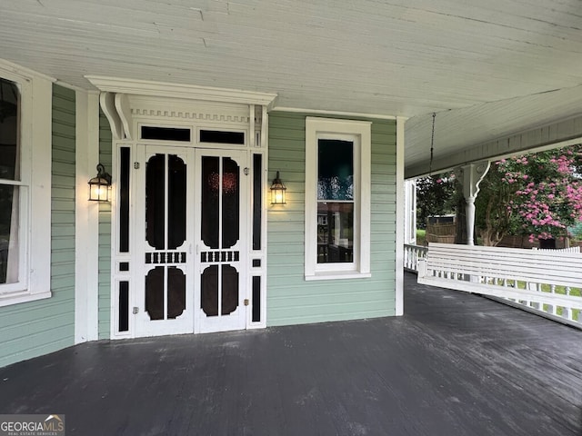 doorway to property with a porch