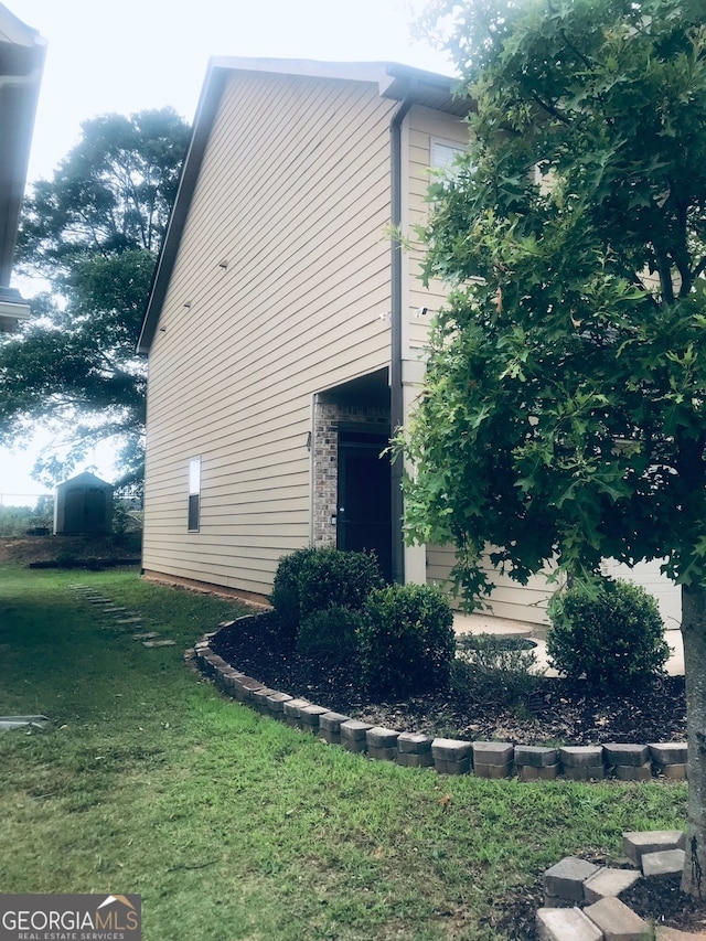 view of property exterior with a yard