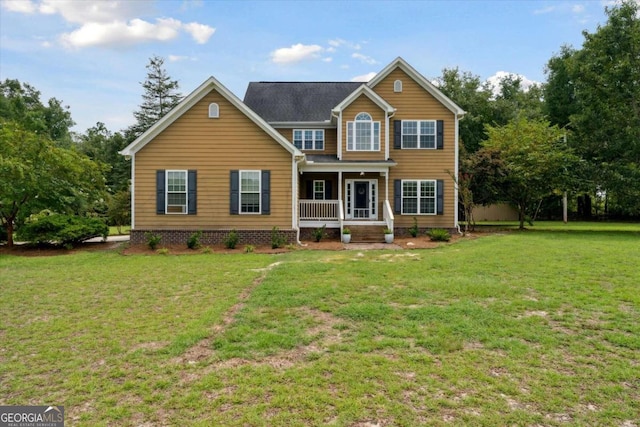 view of front facade featuring a porch and a front yard