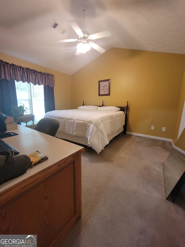 bedroom featuring ceiling fan, vaulted ceiling, and carpet