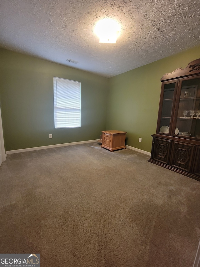 interior space with a textured ceiling