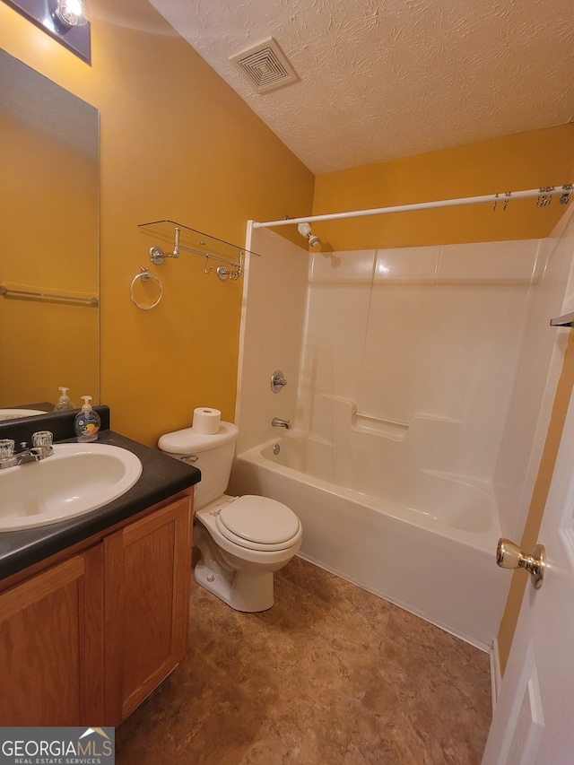 full bathroom featuring a textured ceiling, shower / bathtub combination, vanity, and toilet