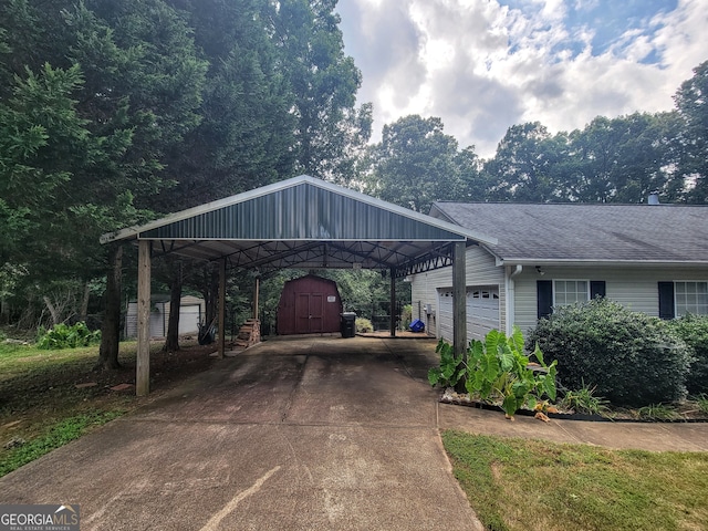 view of front facade featuring a storage shed, a carport, and a garage