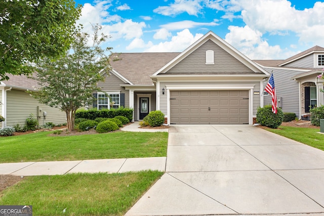 view of front facade featuring a garage and a front lawn