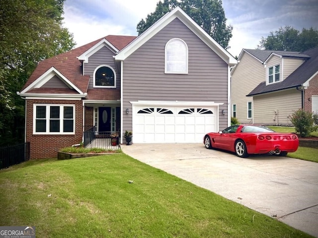 view of front of house with a garage and a front lawn