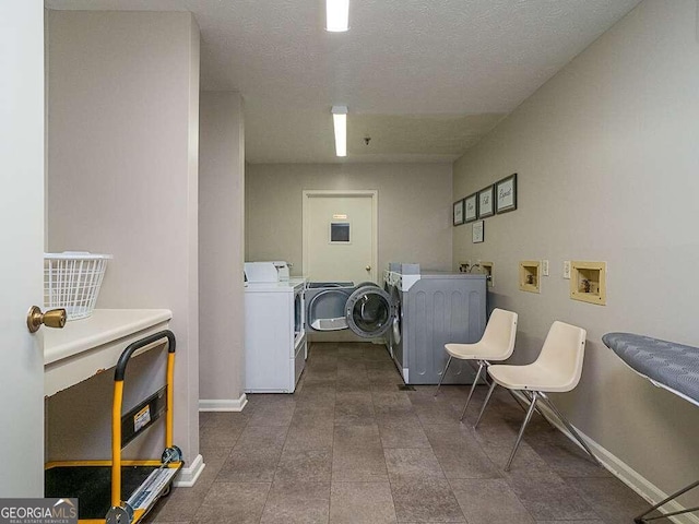 clothes washing area with washer hookup and a textured ceiling