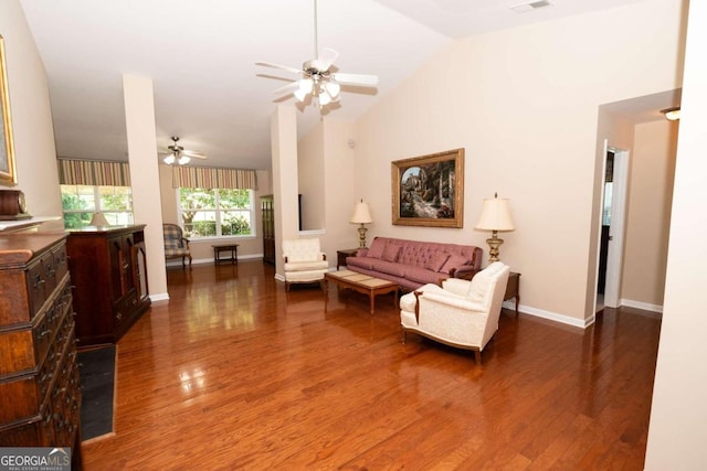 living room with dark hardwood / wood-style flooring, high vaulted ceiling, and ceiling fan