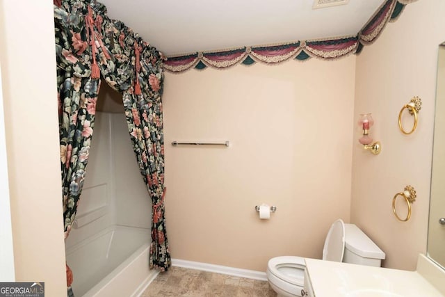 full bathroom with vanity, shower / bath combo with shower curtain, and toilet