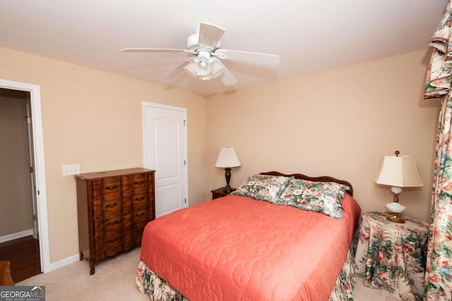 carpeted bedroom with ceiling fan