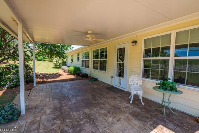 view of patio featuring ceiling fan