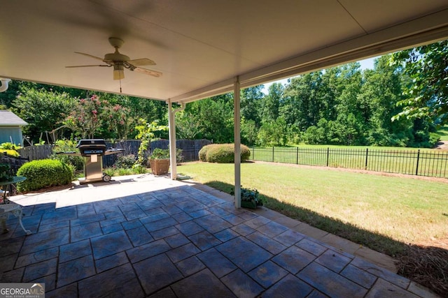 view of patio featuring area for grilling and ceiling fan