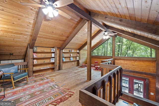 interior space with lofted ceiling with beams and wood ceiling