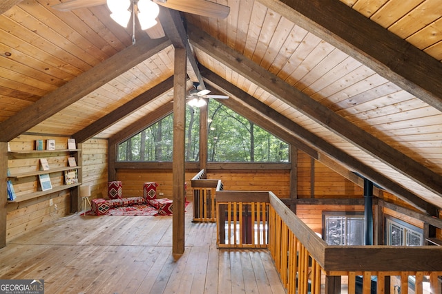 bonus room with wooden ceiling, lofted ceiling with beams, wood-type flooring, and a healthy amount of sunlight