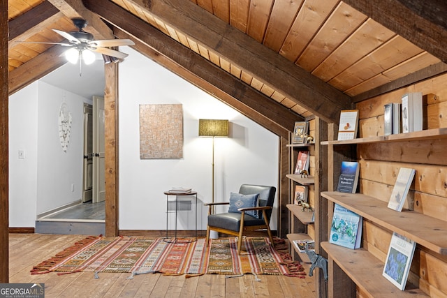 living area with lofted ceiling with beams, wooden ceiling, and hardwood / wood-style flooring