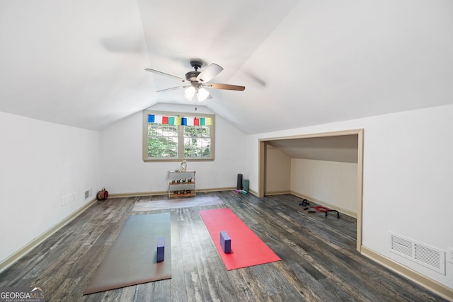 additional living space with ceiling fan, vaulted ceiling, and dark wood-type flooring