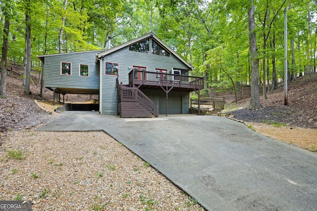 view of front facade with a wooden deck