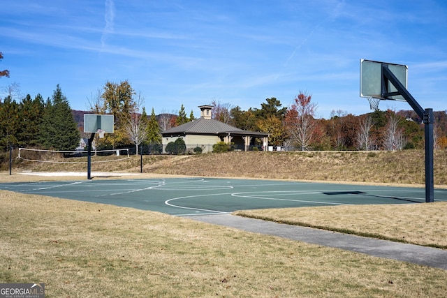 view of sport court featuring volleyball court, a gazebo, and a lawn