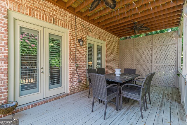 wooden terrace with ceiling fan and french doors