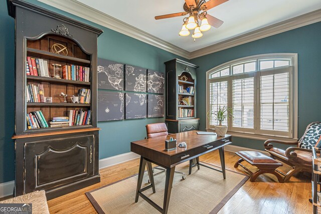 office space featuring ceiling fan, light hardwood / wood-style floors, and crown molding