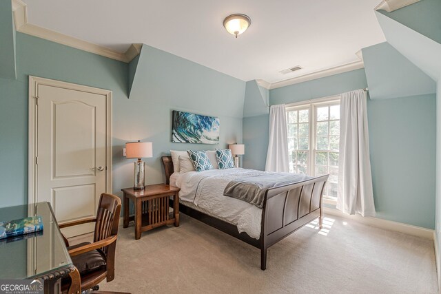 carpeted bedroom featuring crown molding