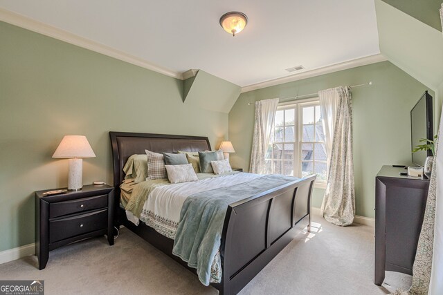 carpeted bedroom featuring crown molding