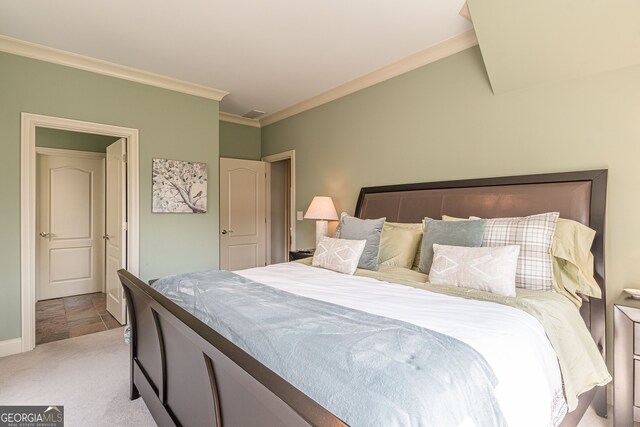 bedroom featuring light carpet and crown molding