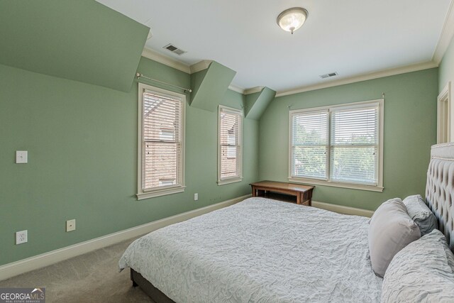 bedroom featuring carpet flooring and crown molding