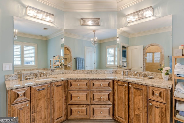 1829 Buckhead Valley Ln NE, Atlanta, GA 30324 - full bathroom featuring ornamental molding, a sink, and an inviting chandelier