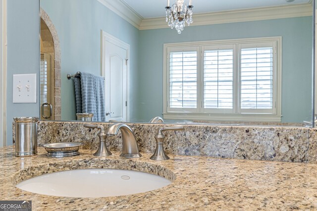 bathroom featuring ornamental molding, vanity, and walk in shower