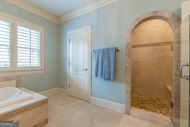 bathroom featuring crown molding, independent shower and bath, and tile patterned floors