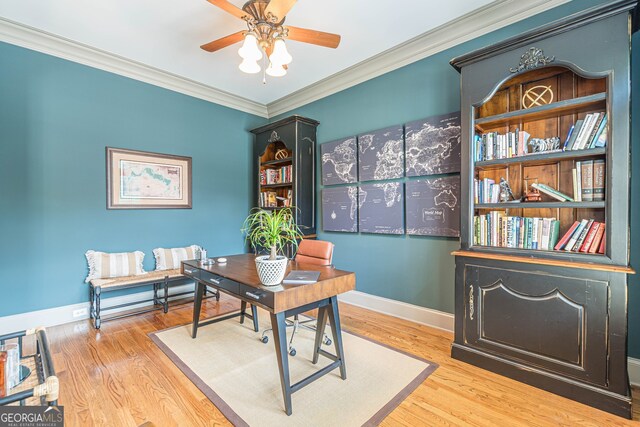 home office featuring ornamental molding, light hardwood / wood-style flooring, and ceiling fan